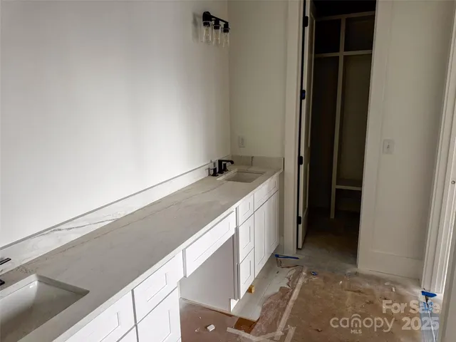 a bathroom with a glass shower door