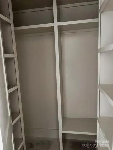 a bedroom with a bed and a balcony view