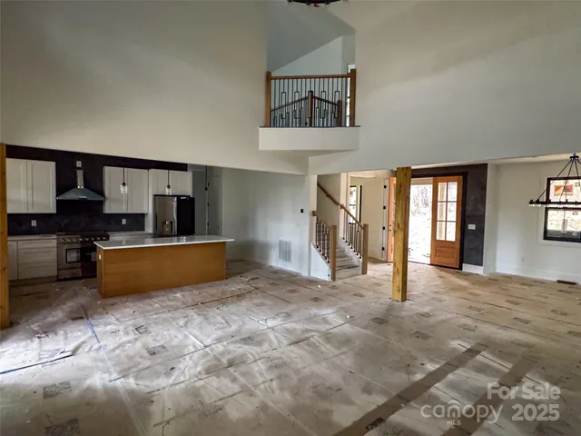 a view of a kitchen with a sink and cabinets