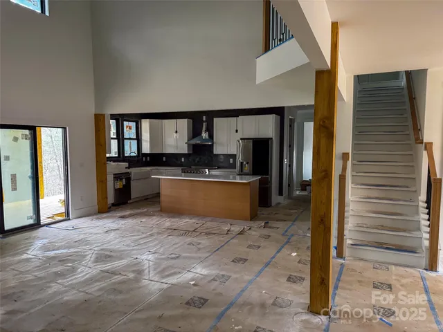 a large kitchen with cabinets and stainless steel appliances