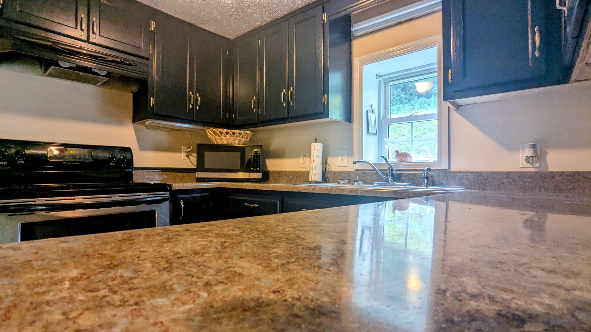 335 Turkey Creek Road Carthage, TN 37030 - Photo 11 of 36 a kitchen with stainless steel appliances granite countertop a stove and a sink