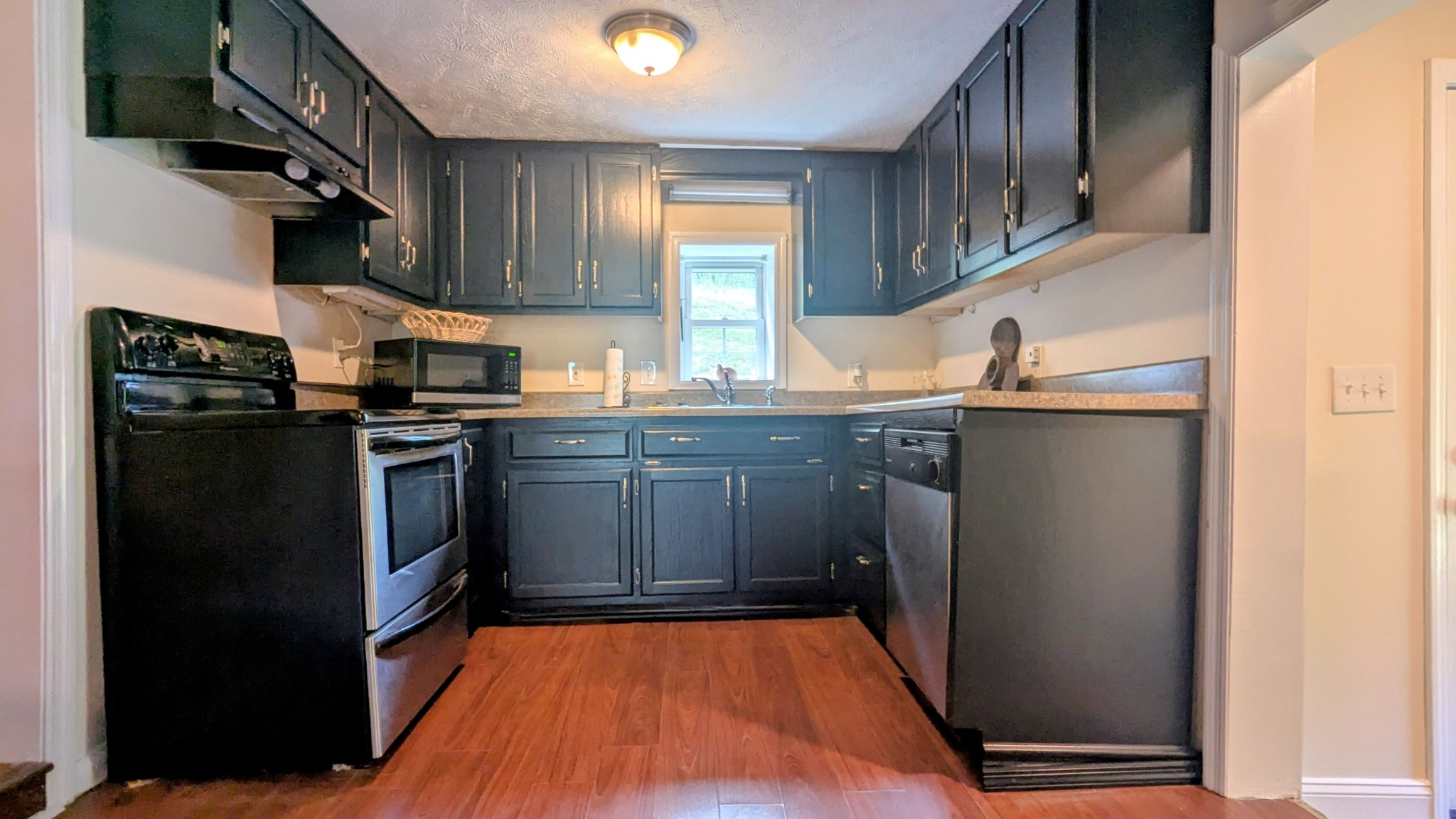 335 Turkey Creek Road Carthage, TN 37030 - Photo 13 of 36 a kitchen with stainless steel appliances granite countertop a refrigerator a sink a stove and island