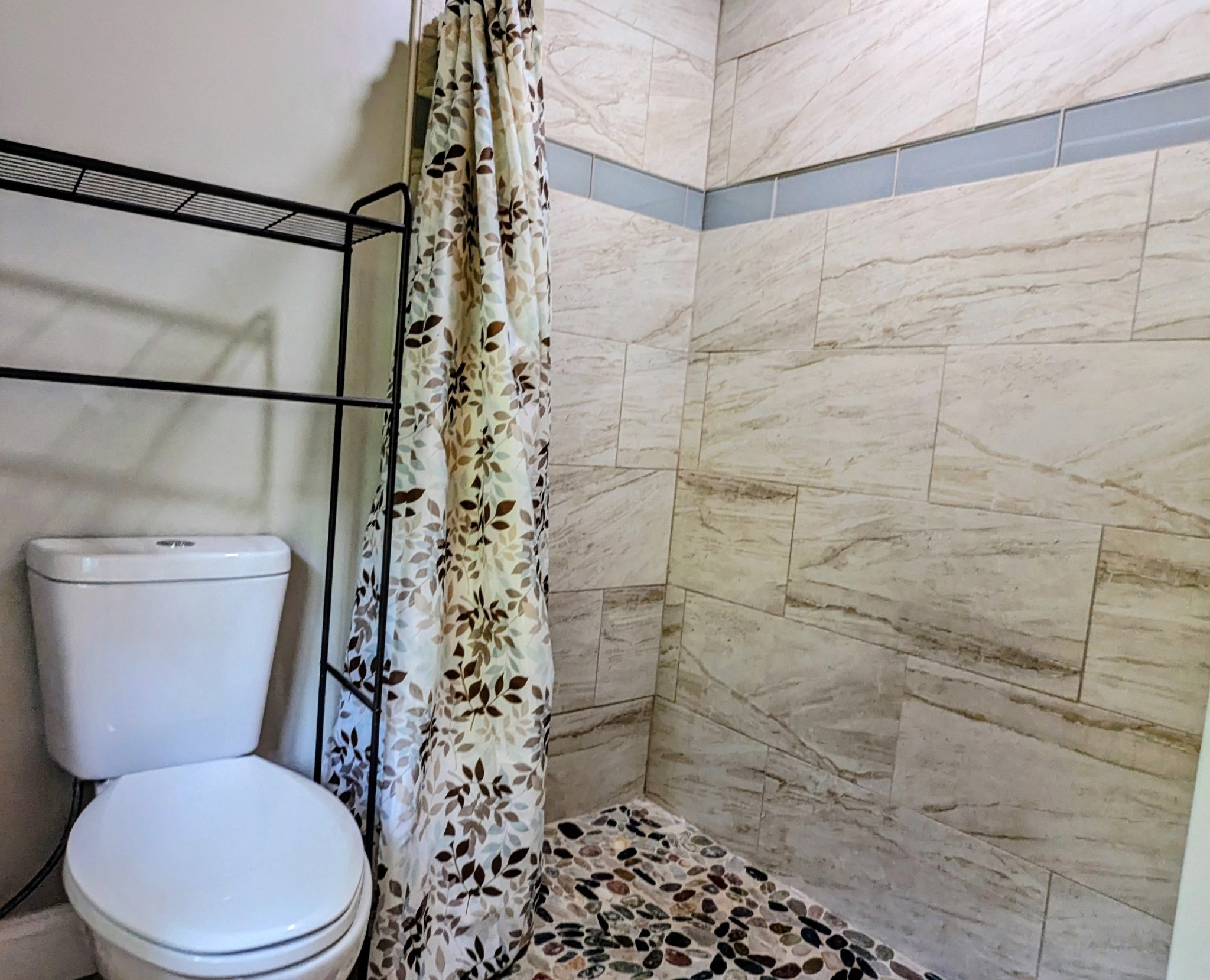 335 Turkey Creek Road Carthage, TN 37030 - Photo 19 of 36 a white toilet sitting next to a shower curtain