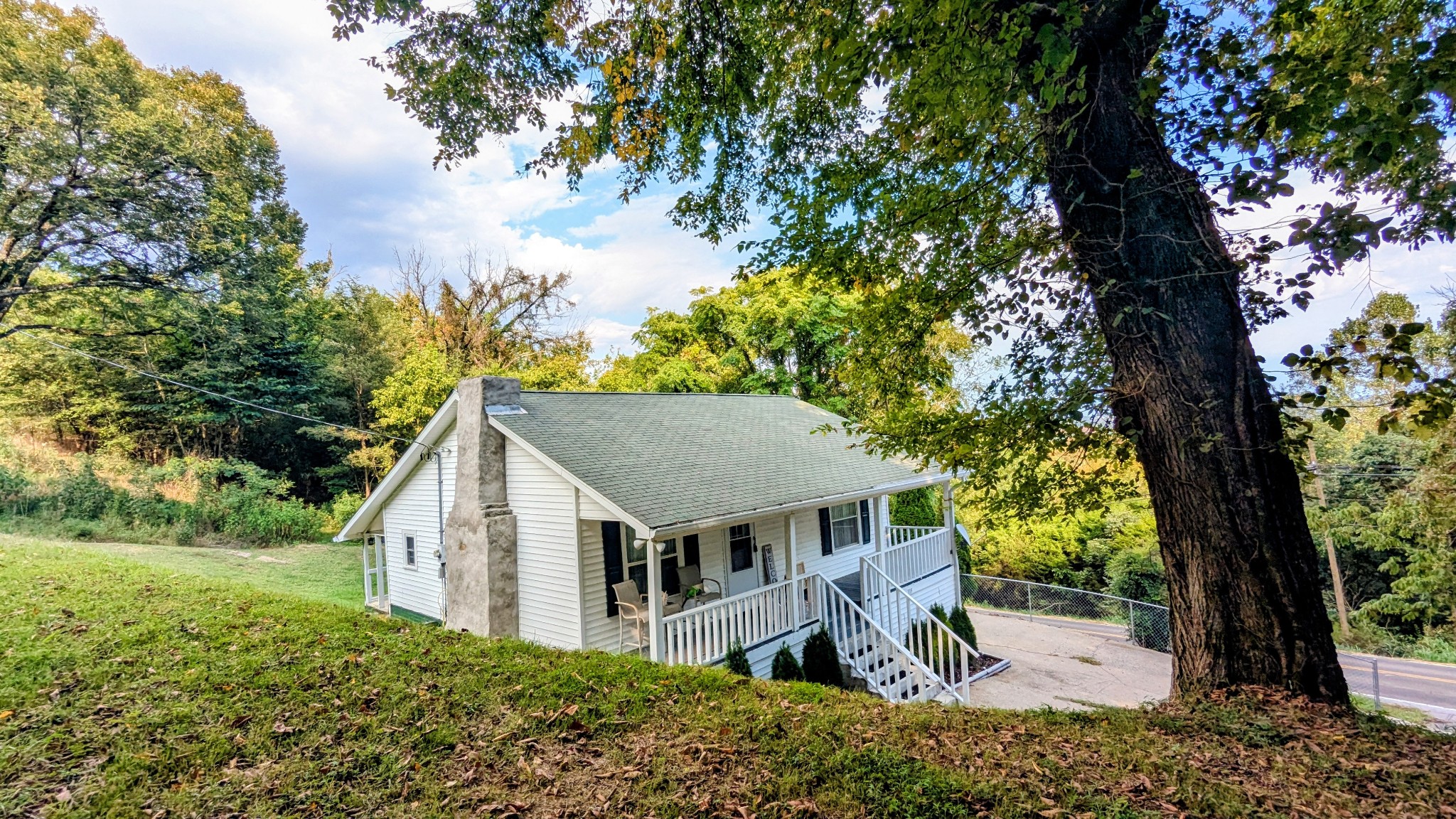 335 Turkey Creek Road Carthage, TN 37030 - Photo 34 of 36 a view of a house with a tree and a yard