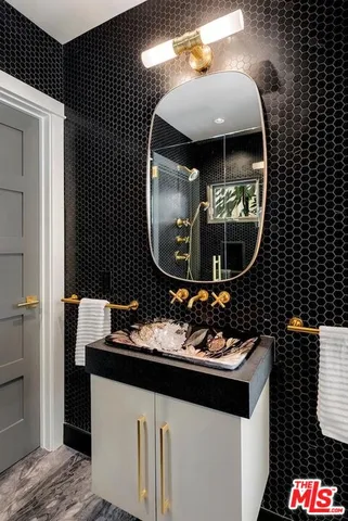 a bathroom with a sink and a mirror