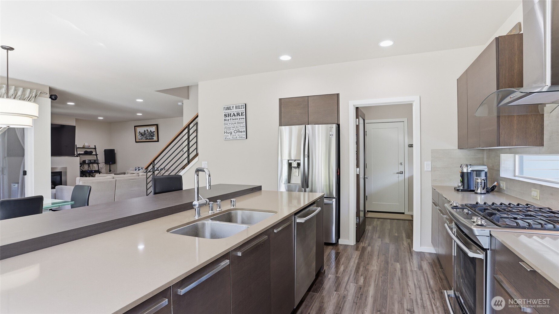 3709 Northeast 24th Street Renton, WA 98056 - Photo 14 of 37 a kitchen with stainless steel appliances granite countertop a sink a stove and a refrigerator