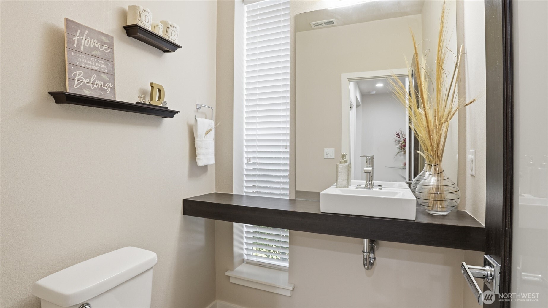 3709 Northeast 24th Street Renton, WA 98056 - Photo 16 of 37 a bathroom with a sink a toilet and mirror