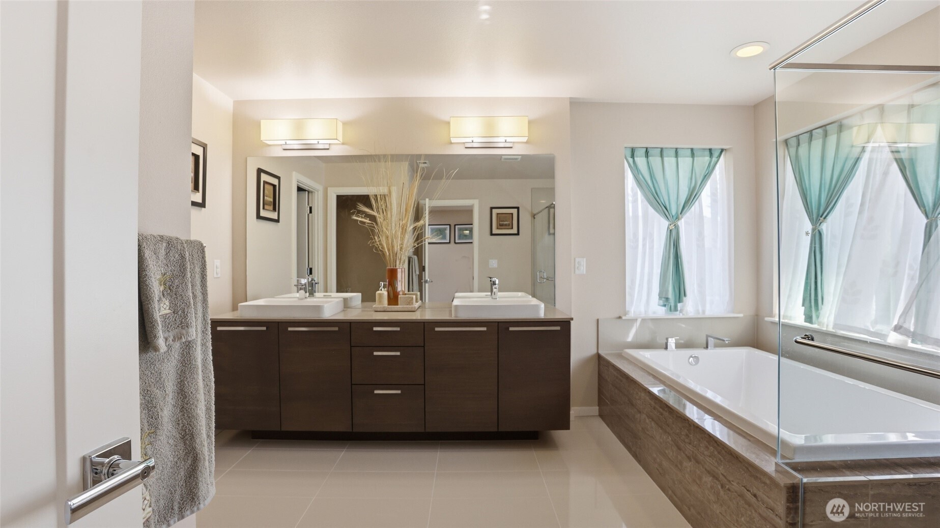 3709 Northeast 24th Street Renton, WA 98056 - Photo 20 of 37 a spacious bathroom with a tub sink and mirror