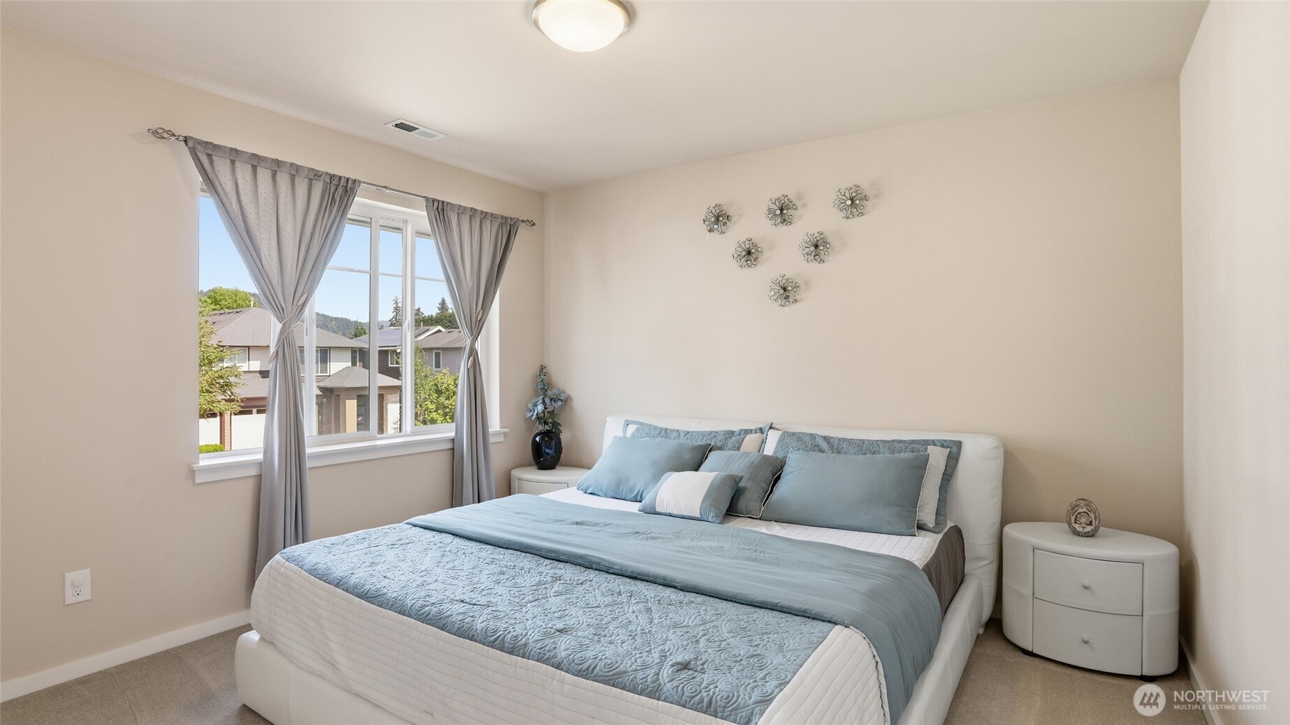 3709 Northeast 24th Street Renton, WA 98056 - Photo 24 of 37 a bedroom with a bed and a window