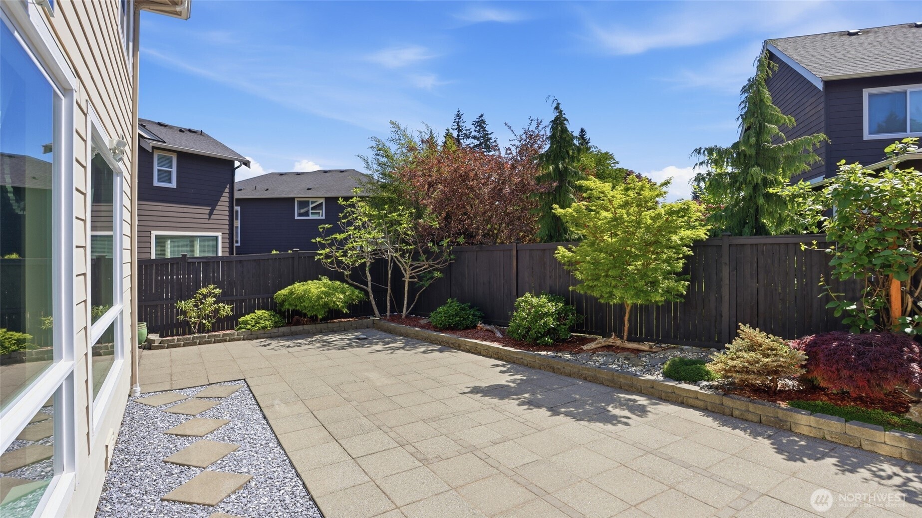3709 Northeast 24th Street Renton, WA 98056 - Photo 31 of 37 a view of a house with a yard and a garden