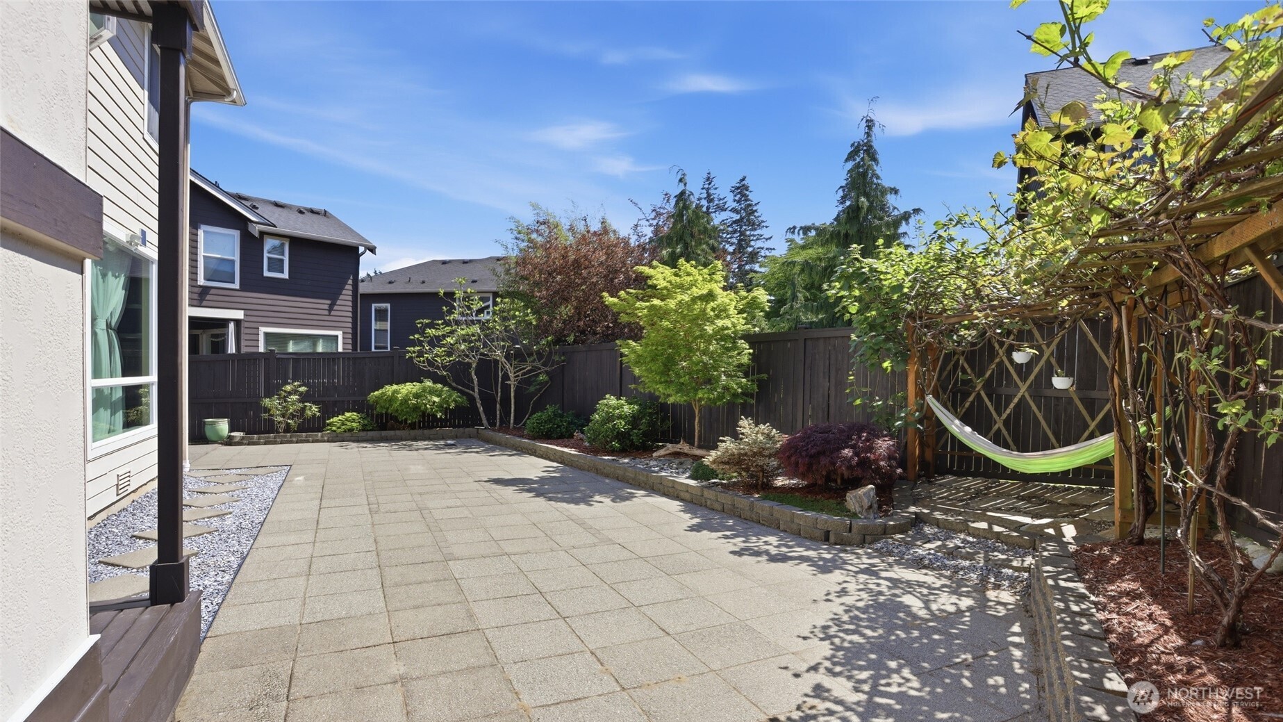 3709 Northeast 24th Street Renton, WA 98056 - Photo 34 of 37 a view of a chair and tables in the patio in front of a house