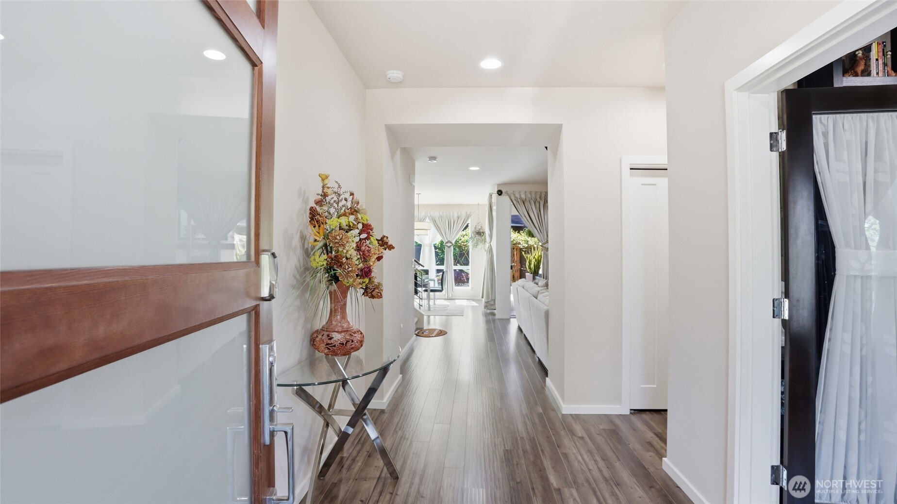 3709 Northeast 24th Street Renton, WA 98056 - Photo 5 of 37 a view of a hallway with wooden floor and staircase
