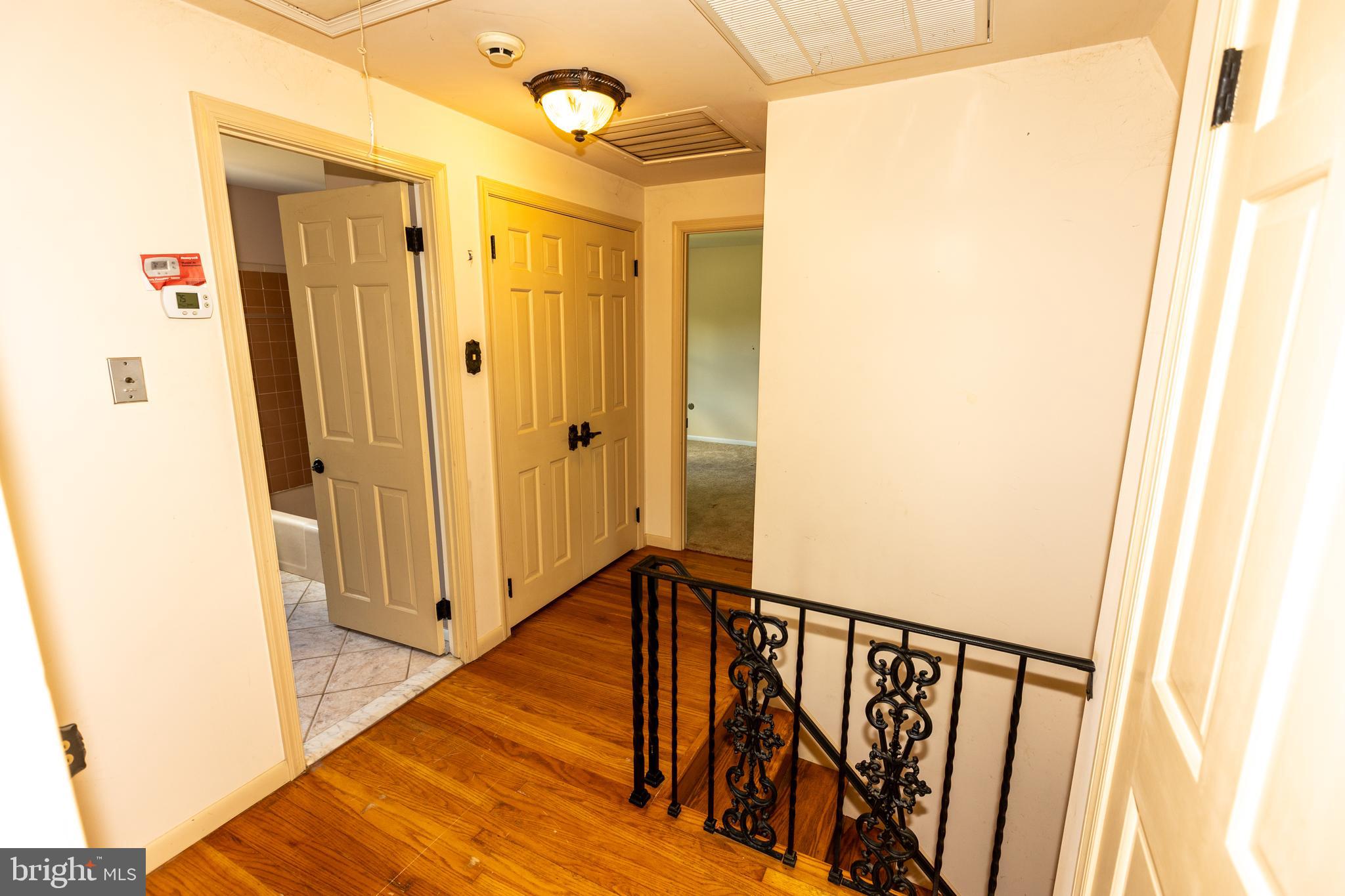 1929 Hillendale Road Chadds Ford, PA 19317 - Photo 33 of 56 a view of a hallway with wooden floor and entryway