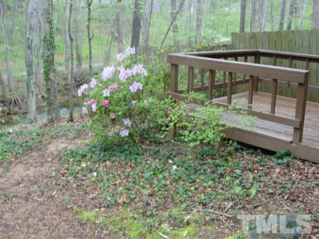 7286 Shellburne Drive, Unit J1 Raleigh, NC 27612 - Photo 2 of 11 a view of a backyard with plants