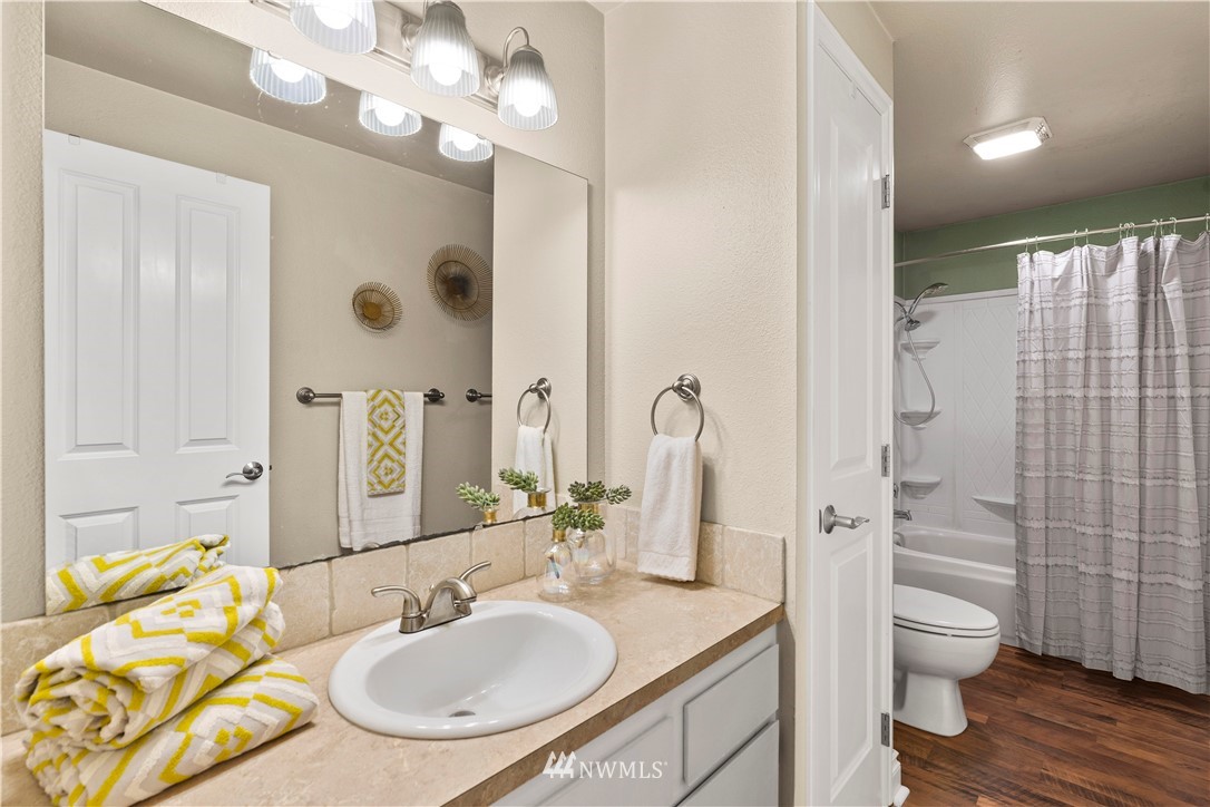 4321 234th Place Southeast Bothell, WA 98021 - Photo 12 of 25 a bathroom with a sink a toilet and shower