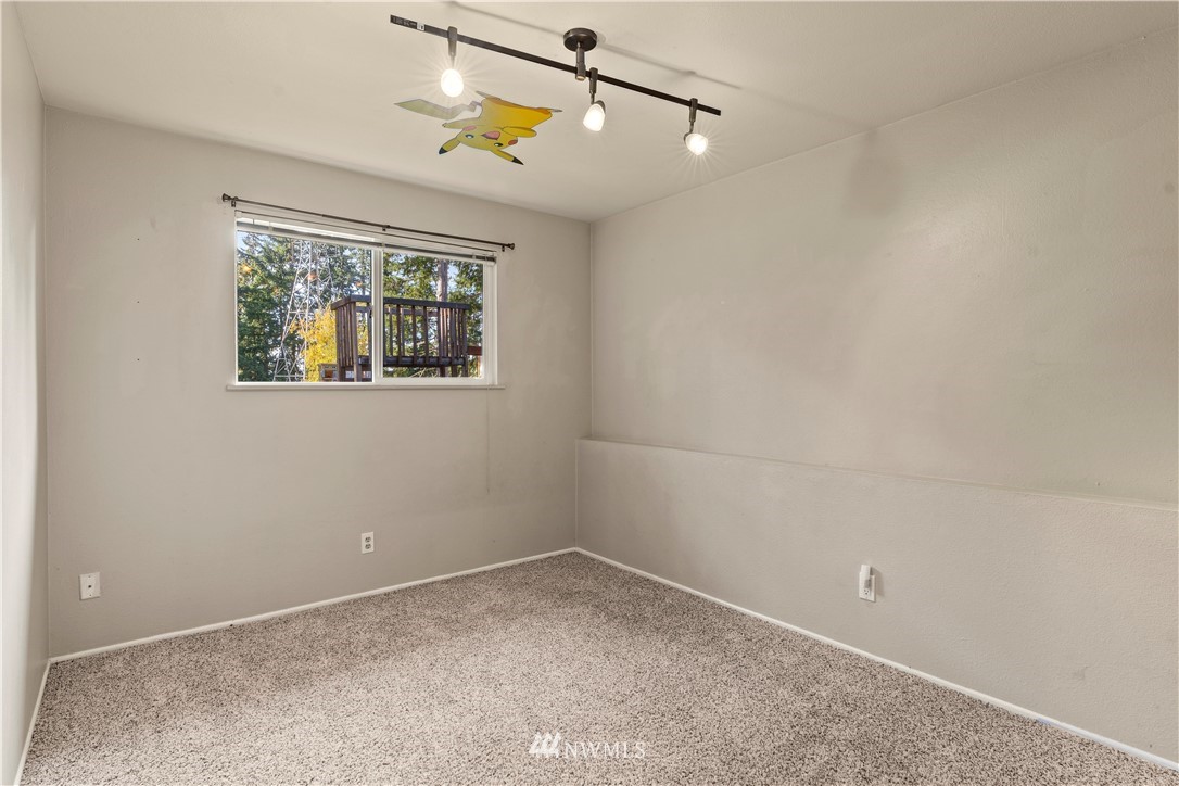 4321 234th Place Southeast Bothell, WA 98021 - Photo 19 of 25 an empty room with windows and fan
