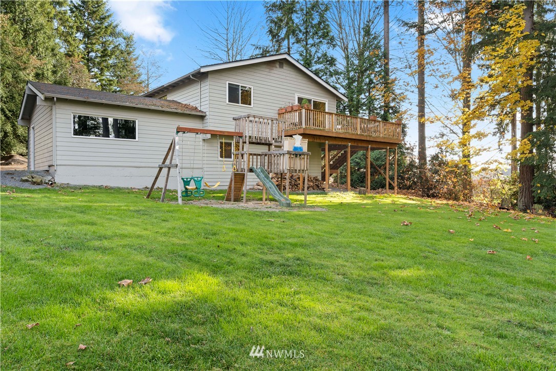 4321 234th Place Southeast Bothell, WA 98021 - Photo 22 of 25 a view of a house with a yard and sitting area