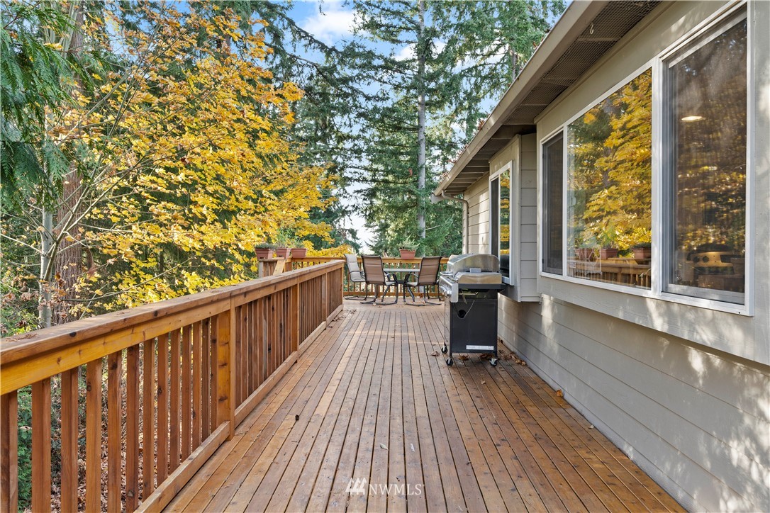 4321 234th Place Southeast Bothell, WA 98021 - Photo 24 of 25 a view of a balcony with chairs and wooden floor