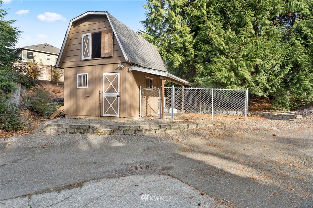4321 234th Place Southeast Bothell, WA 98021 - Photo 25 of 25 a view of a house with a yard