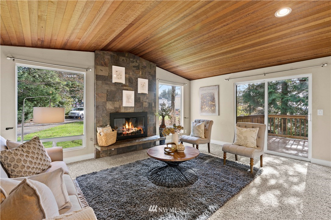 4321 234th Place Southeast Bothell, WA 98021 - Photo 5 of 25 a living room with furniture and a fireplace