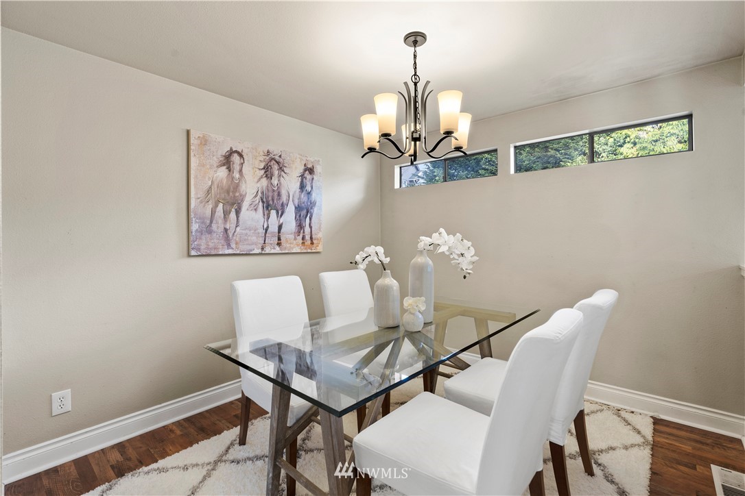 4321 234th Place Southeast Bothell, WA 98021 - Photo 9 of 25 a view of a dining room with furniture and chandelier
