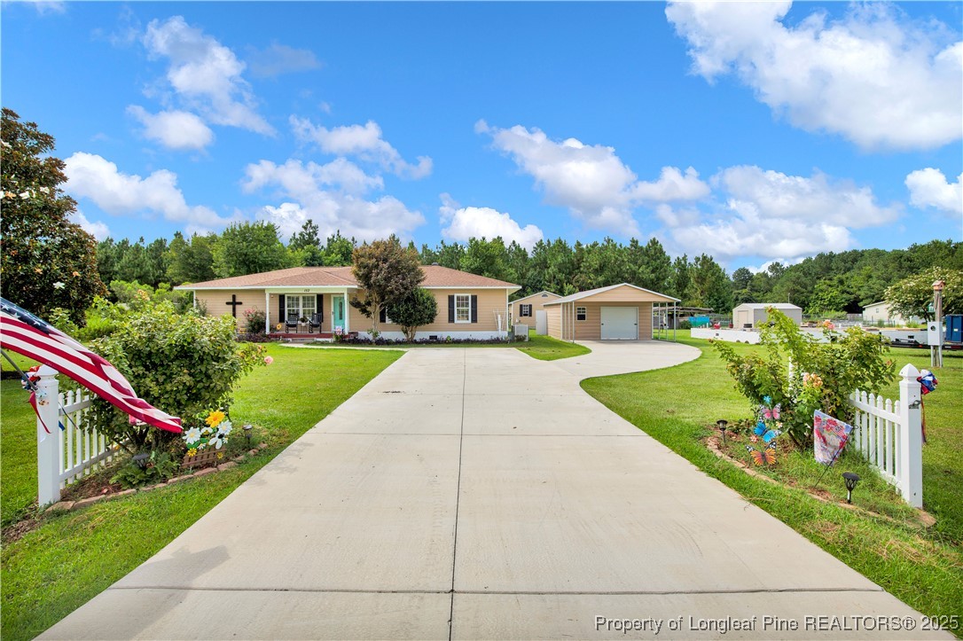 152 Singletary Road Lumberton, NC 28358 - Photo 2 of 33 a view of a house with a yard