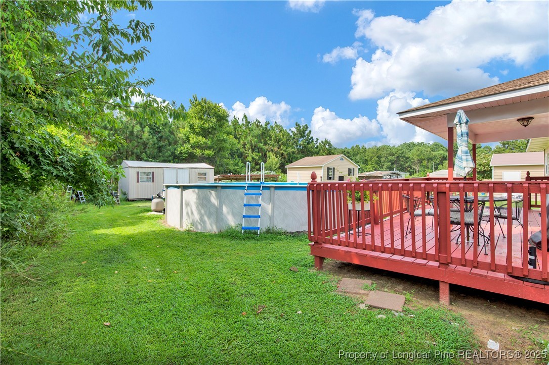 152 Singletary Road Lumberton, NC 28358 - Photo 26 of 33 a view of a deck with a small yard