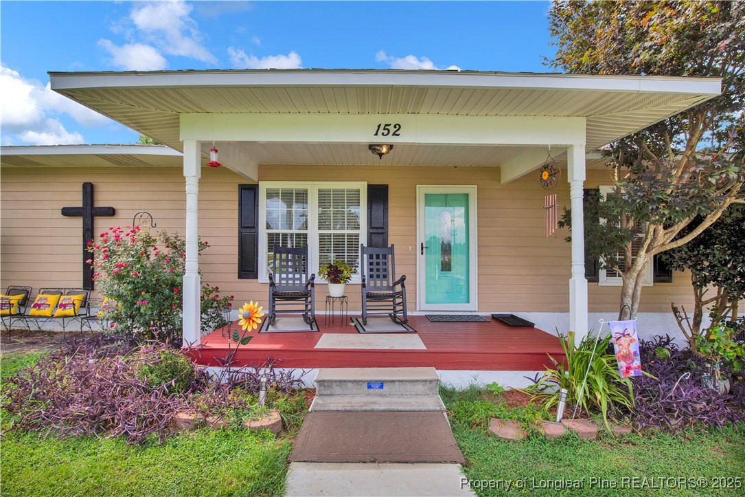 152 Singletary Road Lumberton, NC 28358 - Photo 6 of 33 a view of a house with outdoor space and a garden