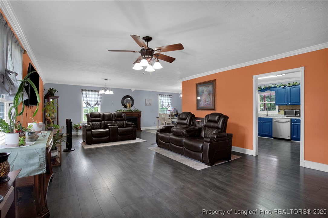 152 Singletary Road Lumberton, NC 28358 - Photo 10 of 33 a living room with furniture and a flat screen tv