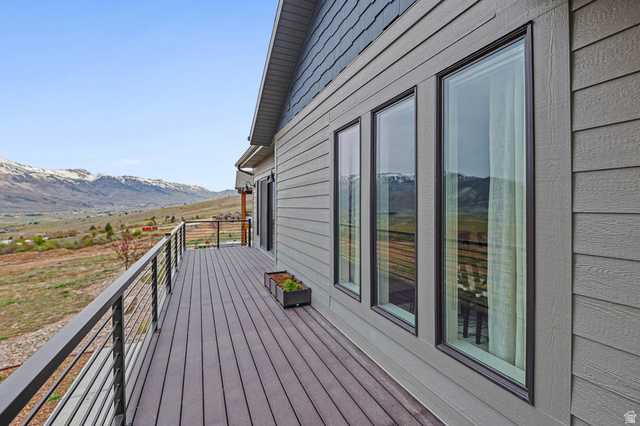 4527 North Seven Bridges Road Eden, UT 84310 - Photo 48 of 65 Deck with a mountain view and a view of countryside