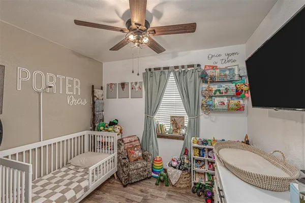 a bedroom with furniture and a window