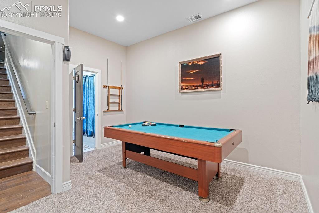 8450 Edison Road Yoder, CO 80864 - Photo 38 of 50 a room with pool table and stairs