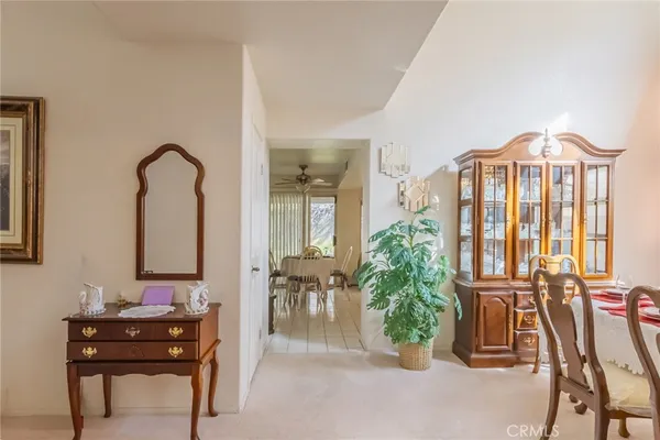 a view of hall way with furniture