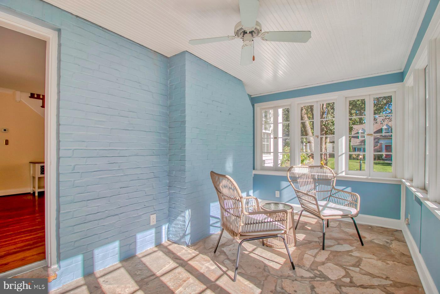 103 Greenbrier Road Towson, MD 21286 - Photo 13 of 53 Side sun porch with windows and ceiling fan