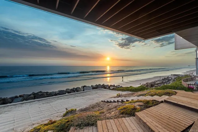 a view of a balcony with an ocean view