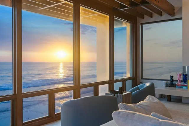 a view of living room with furniture and window