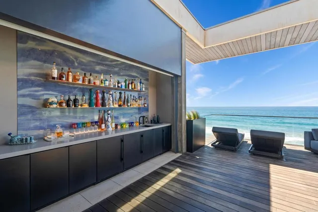 a kitchen with stainless steel appliances wooden floors and wooden cabinets