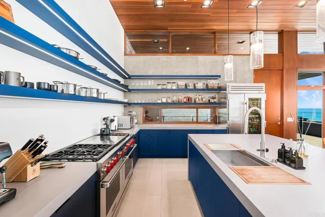 a view of a dining room with furniture large windows and wooden floor