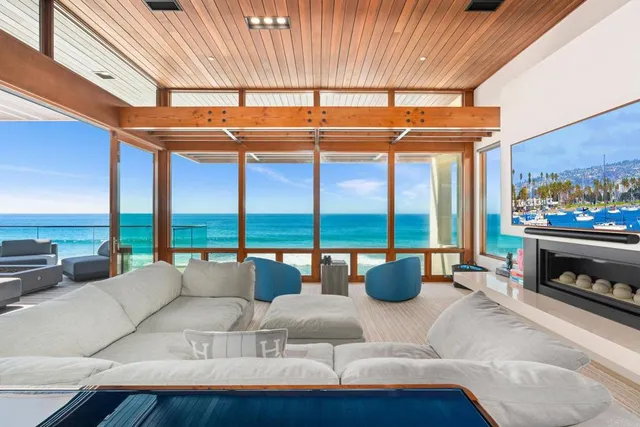 a spacious bedroom with a large window and balcony