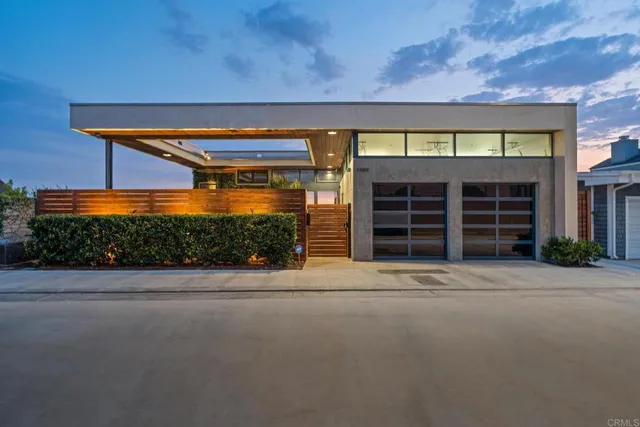 a front view of a house with a garage