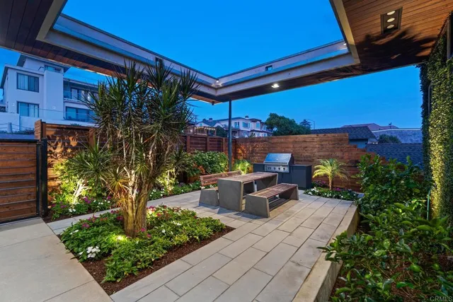 a view of a patio with couches table and chairs potted plants