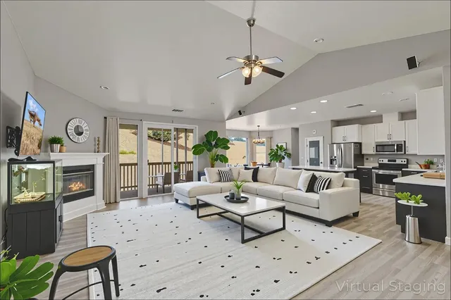 a living room with furniture fireplace and flat screen tv