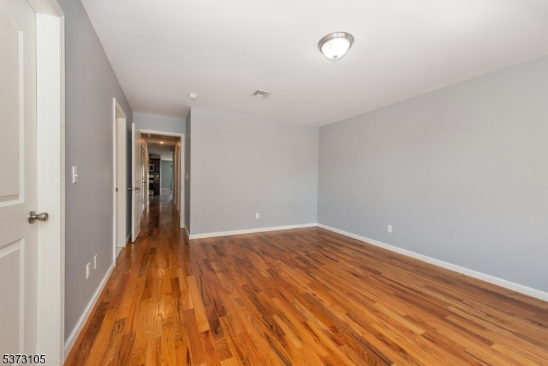 848 Lafayette Street Elizabeth, NJ 07201 - Photo 15 of 21 a view of hallway with wooden floor