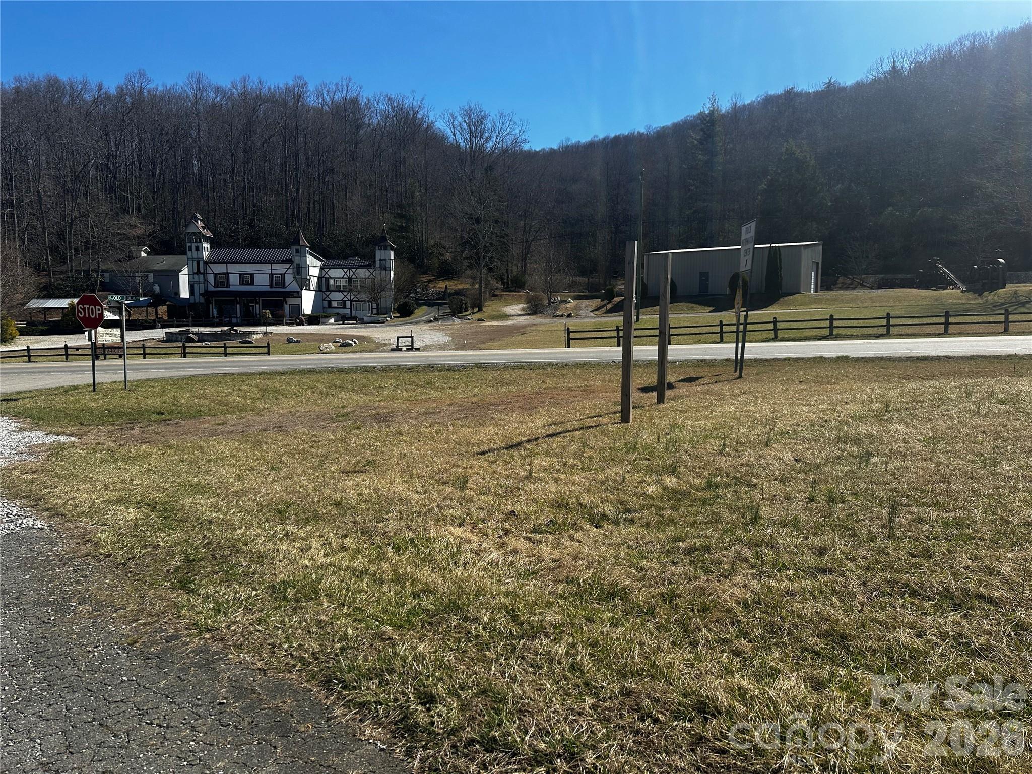 400 Old Dale Road Spruce Pine, NC 28777 - Photo 14 of 24 a view of swimming pool with a yard and trees in the background