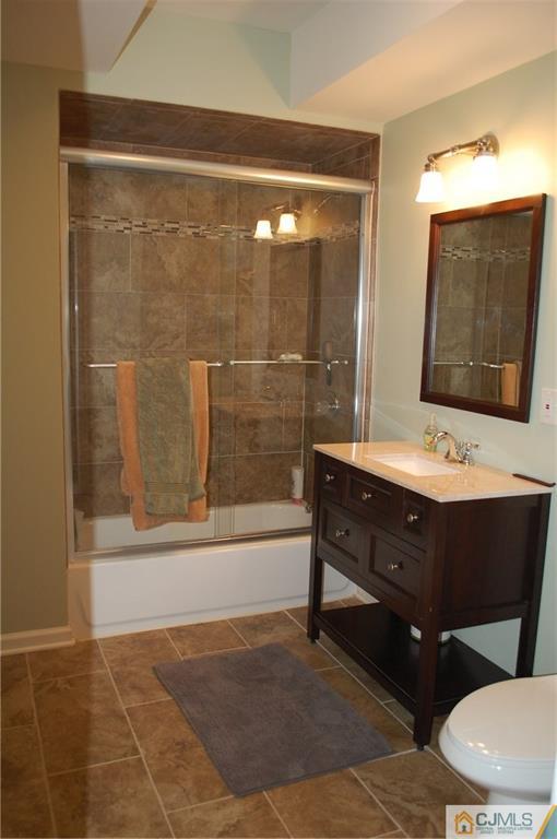 146 Cottrell Road Old Bridge, NJ 07747 - Photo 23 of 25 a bathroom with a sink mirror and a bathtub