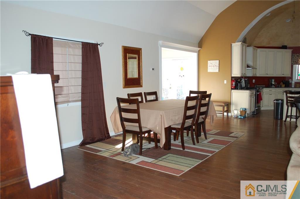 146 Cottrell Road Old Bridge, NJ 07747 - Photo 4 of 25 a view of a dining room with furniture and wooden floor