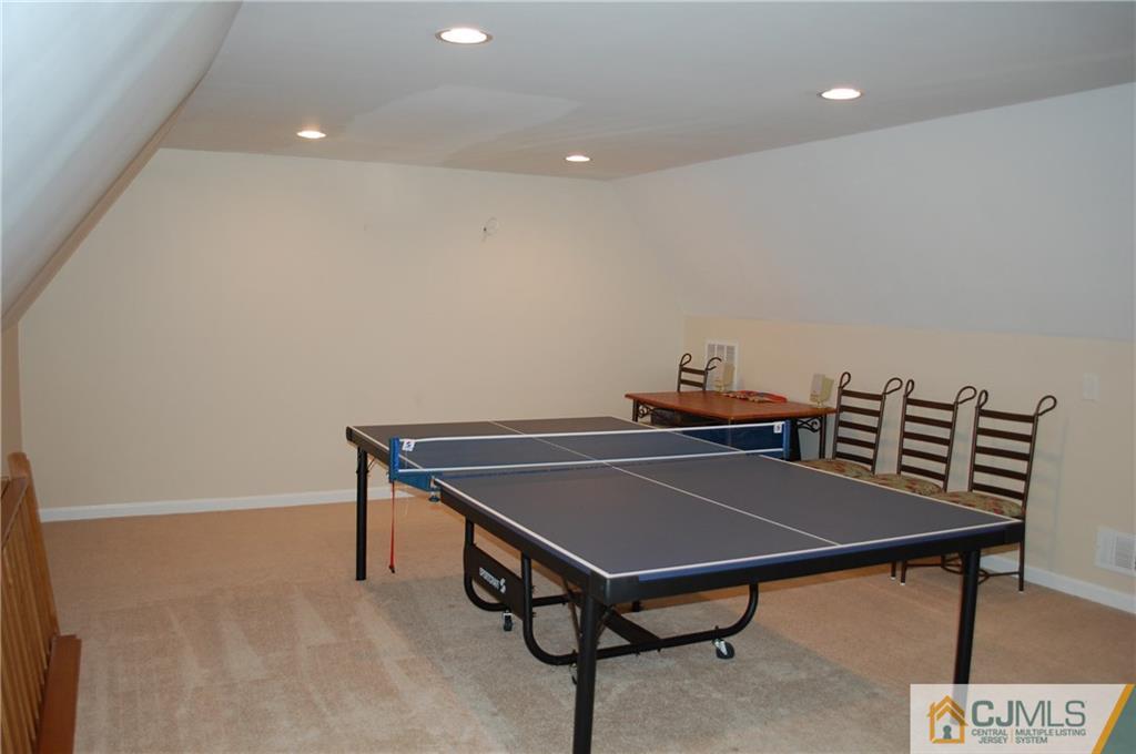 146 Cottrell Road Old Bridge, NJ 07747 - Photo 10 of 25 a living room with a table and chairs