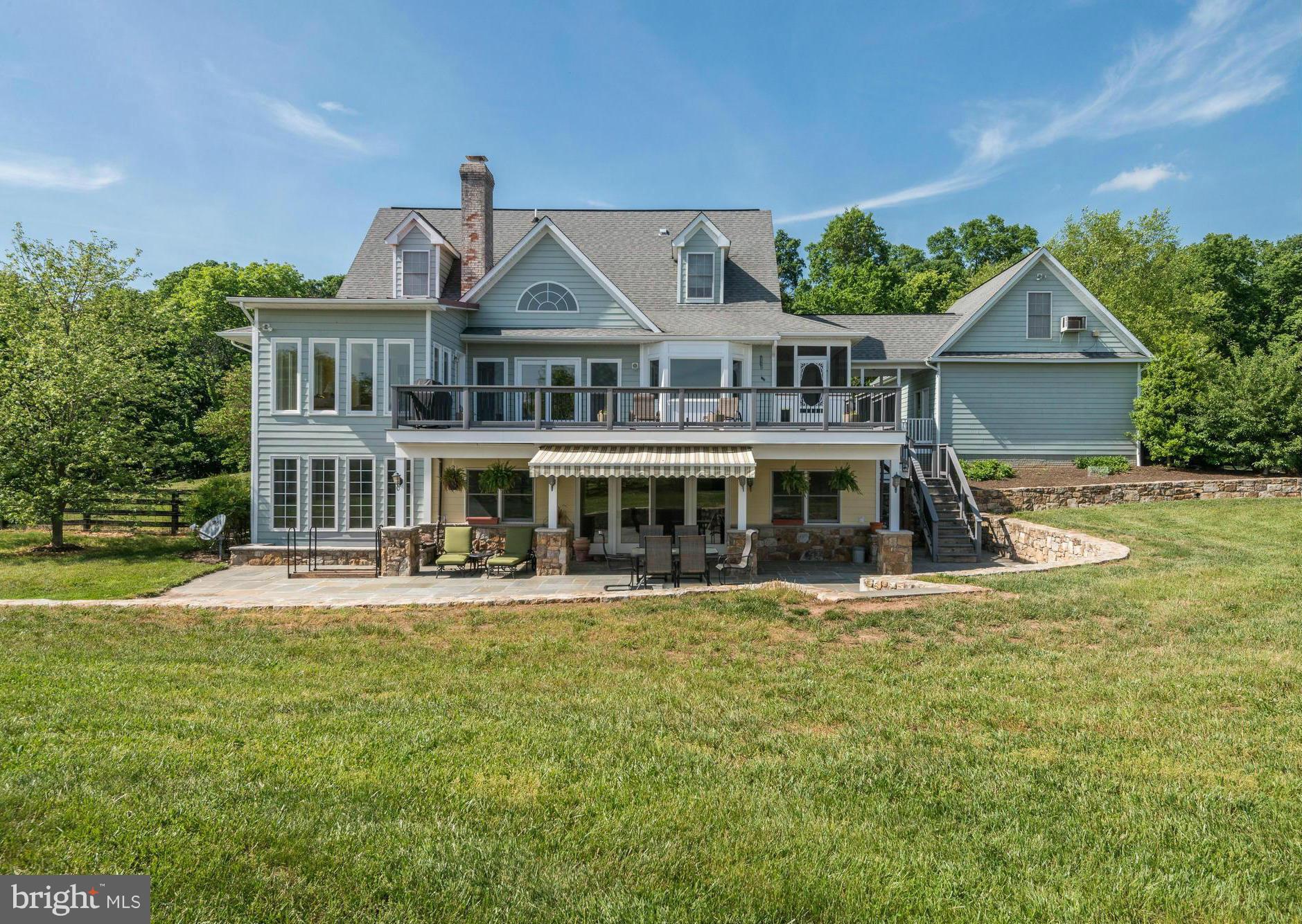 20500 Westerly Road Poolesville, MD 20837 - Photo 2 of 30 a view of a house with a big yard and large trees