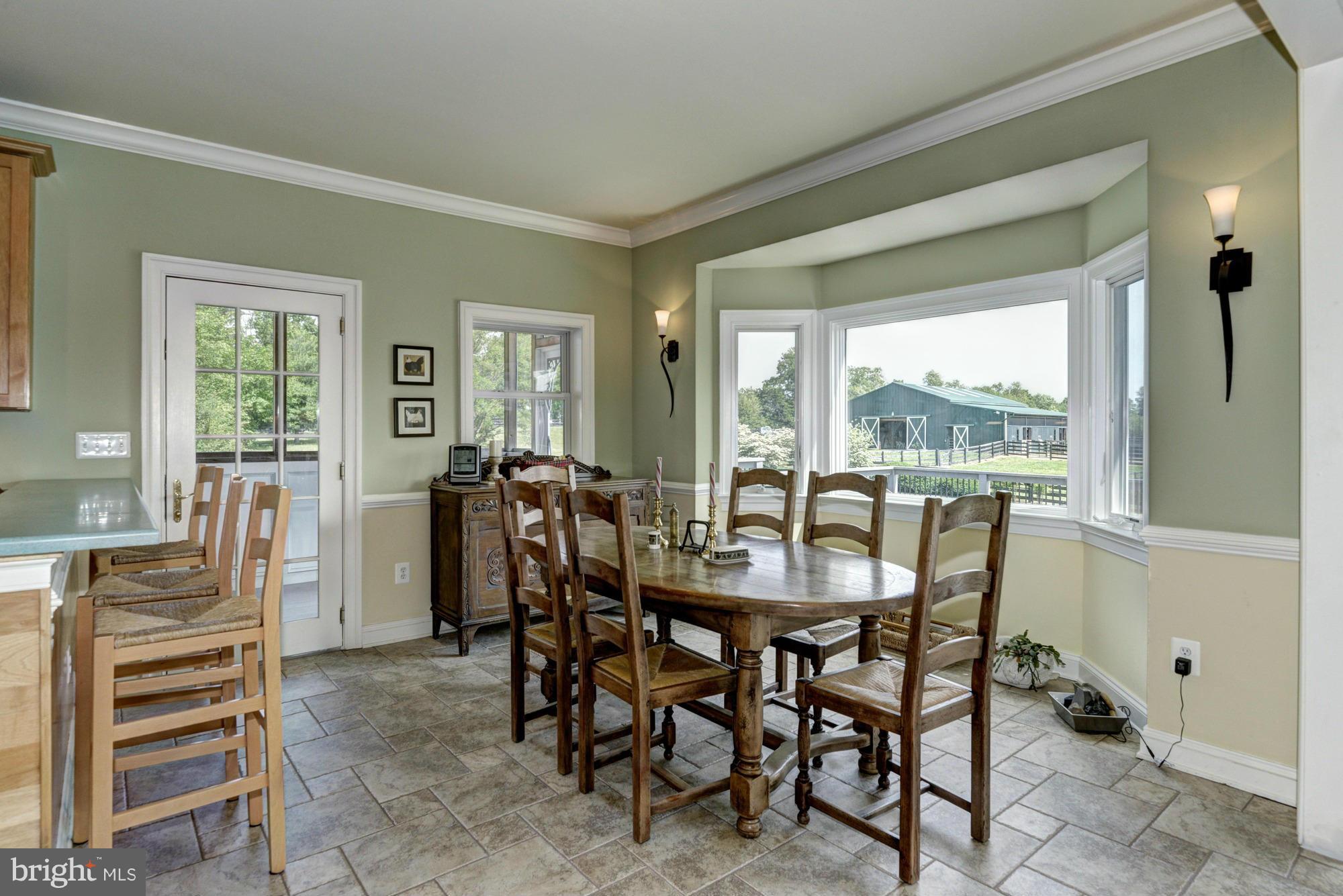 20500 Westerly Road Poolesville, MD 20837 - Photo 12 of 30 a view of a dining room with furniture window and outside view