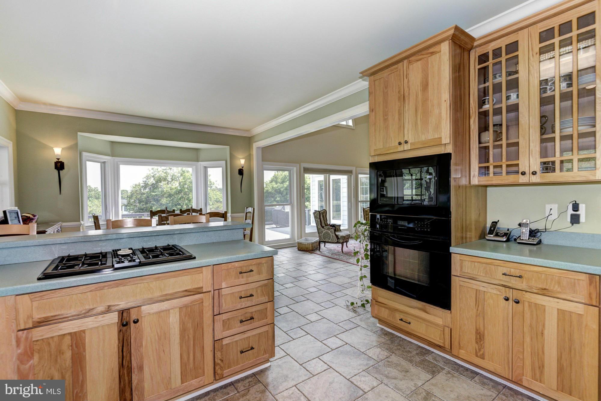 20500 Westerly Road Poolesville, MD 20837 - Photo 14 of 30 a kitchen with stainless steel appliances granite countertop a stove and cabinets